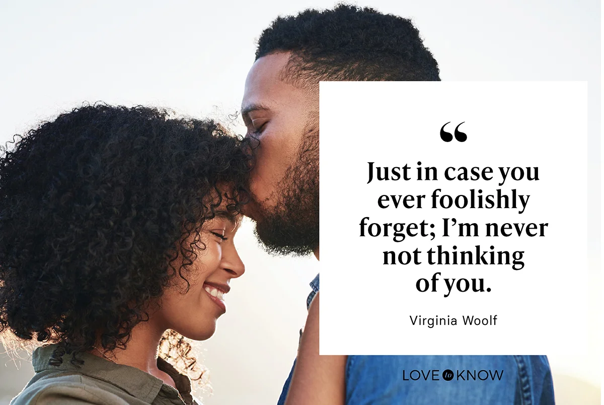 Man kisses girlfriend on the forehead