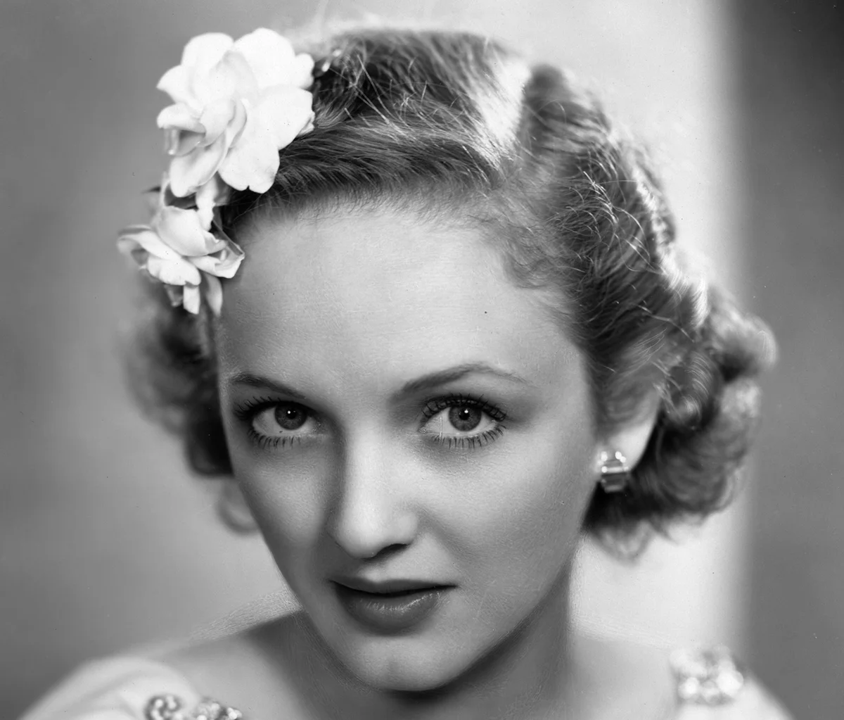 With flowers in her hair, the new Lady Jersey formerly film star Virginia Cherrill