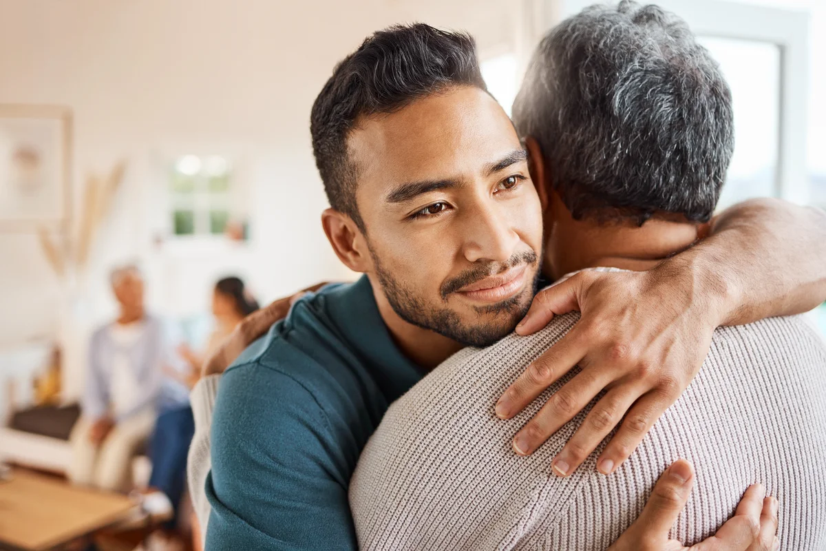 Father and son hugging at home