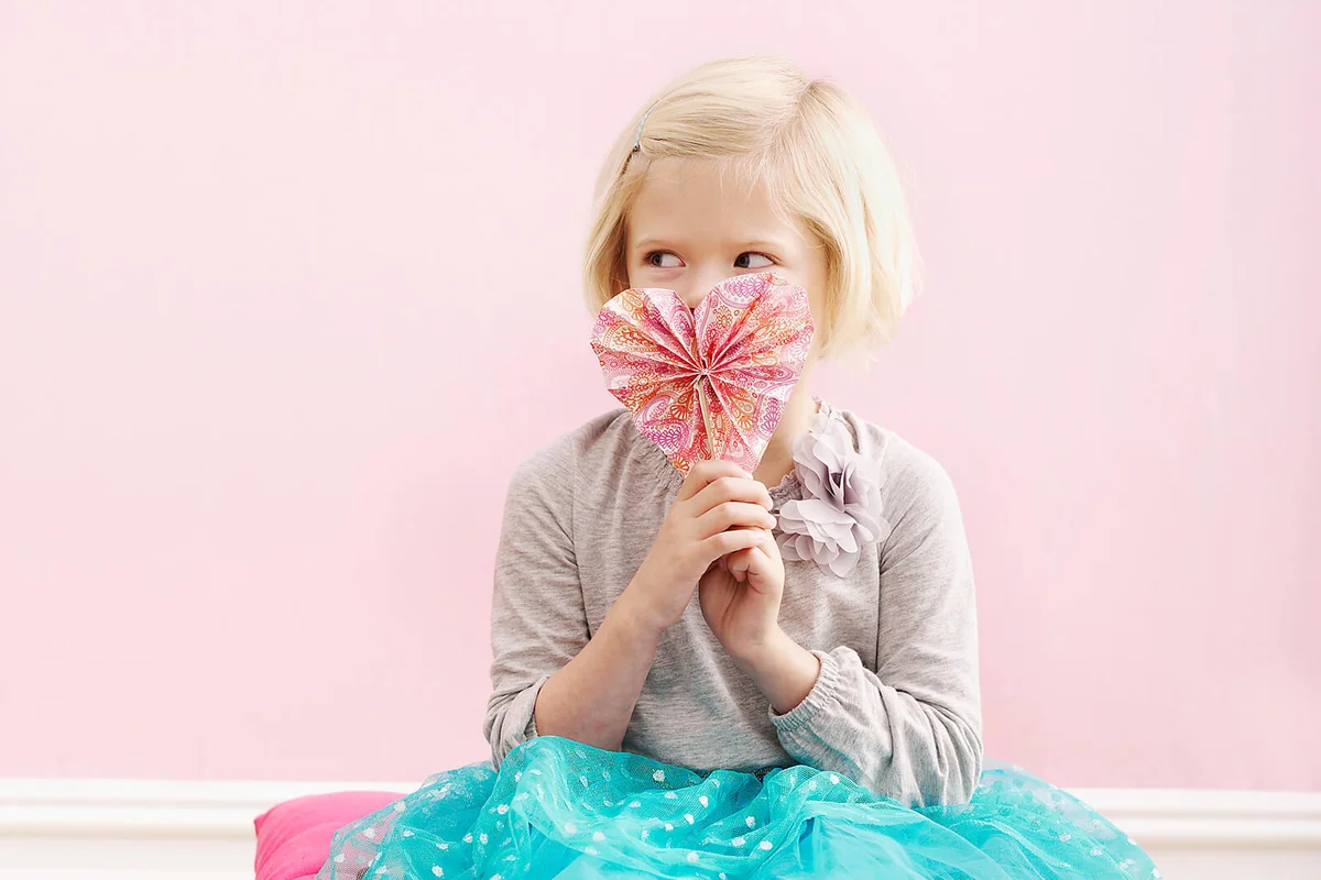 Girl Holding Heart Shaped Fan