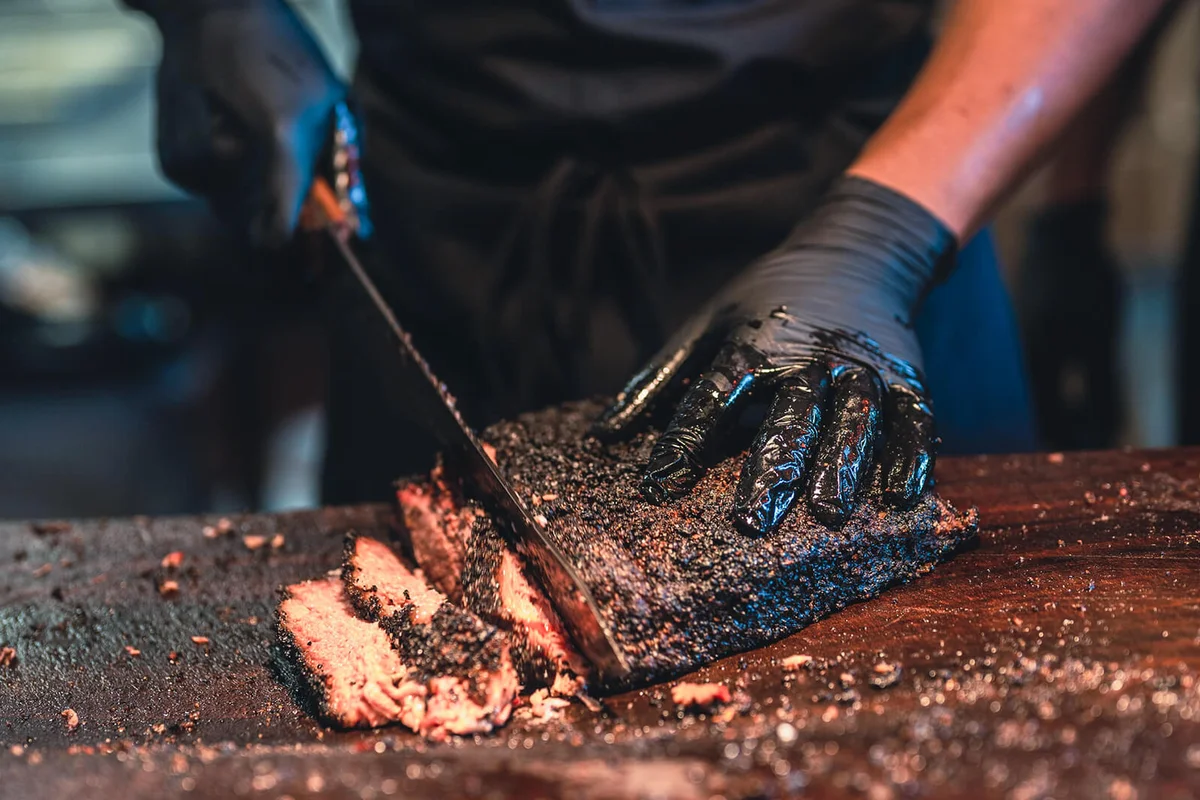 BBQ Chef Cuts Deliciously Tender Smoked Brisket Slices