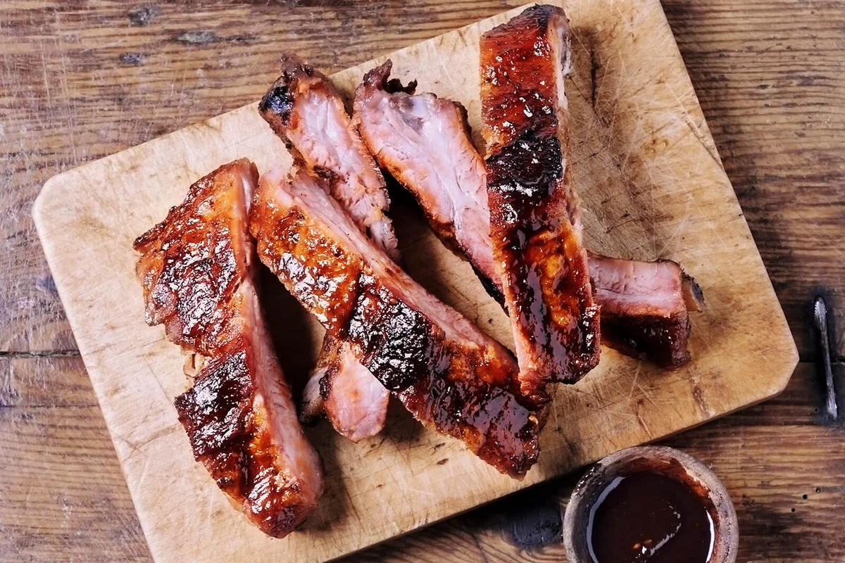 Ribs and a bowl of barbecue sauce