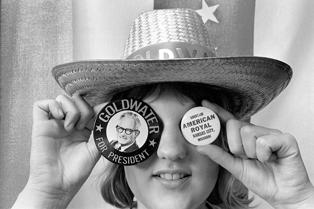 Woman wearing Barry Goldwater campaign buttons