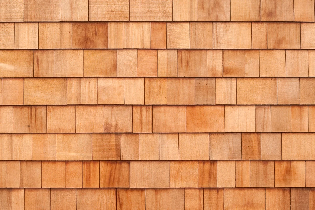 New cedar siding shingles make an attractive wall.
