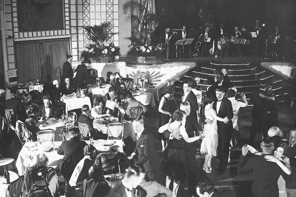 Guests attend a party at a resort by the River Thames in 1926