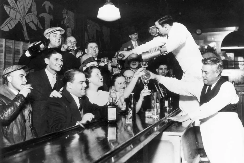 Smiling customers in a speakeasy