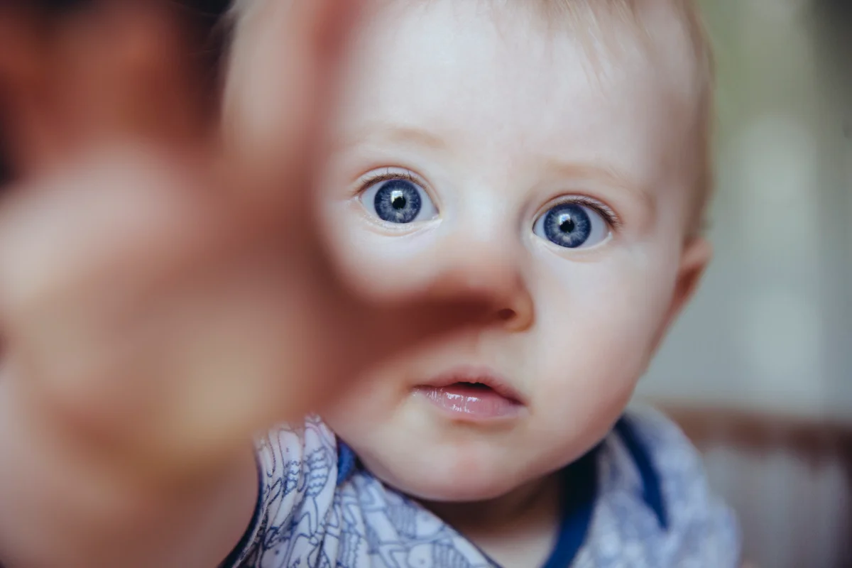 baby reaching for the camera
