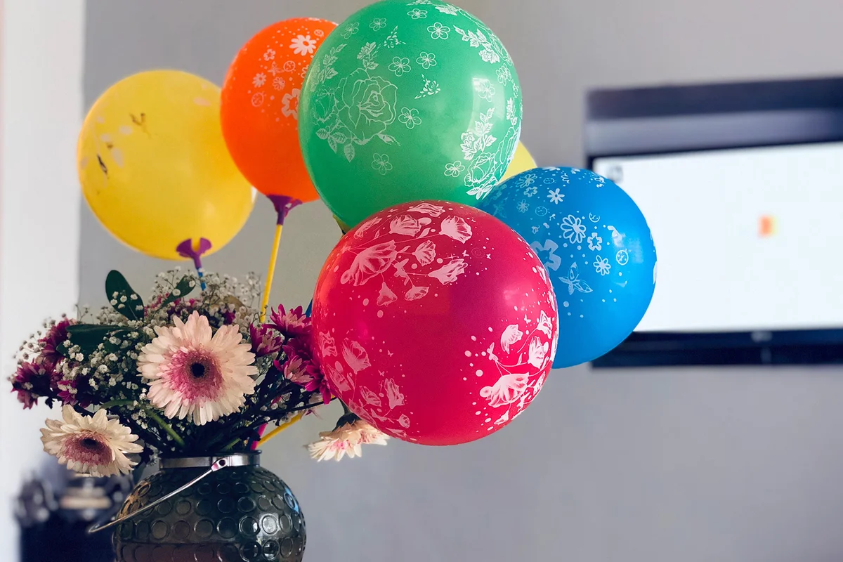 colorful balloons in a flower vase
