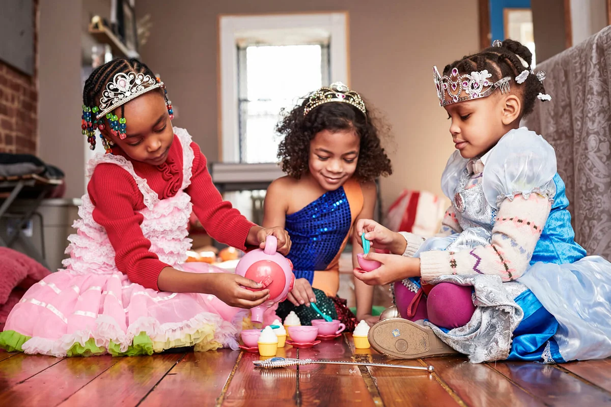 Girls playing dress-up at tea party