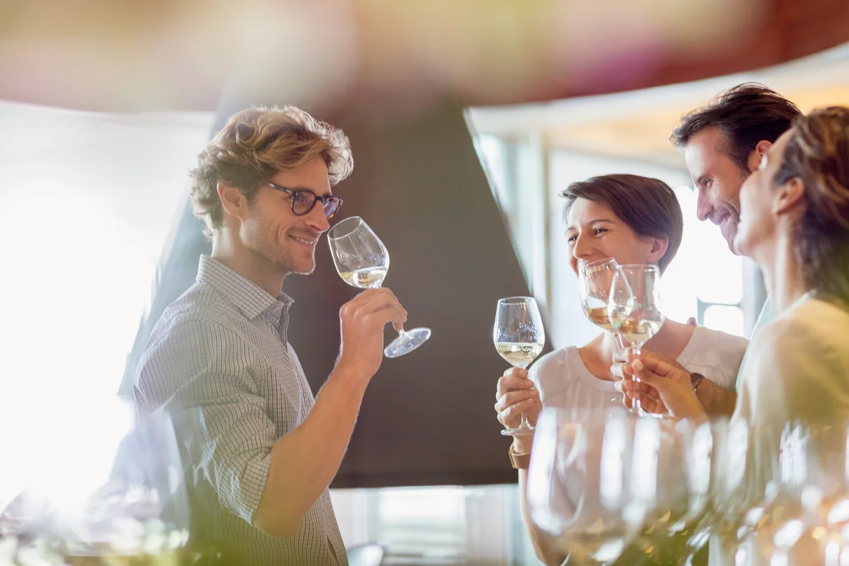 Friends tasting wine