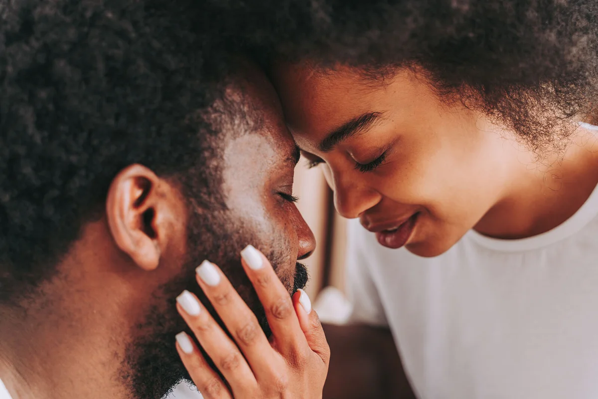 Portrait Of Couple Kissing