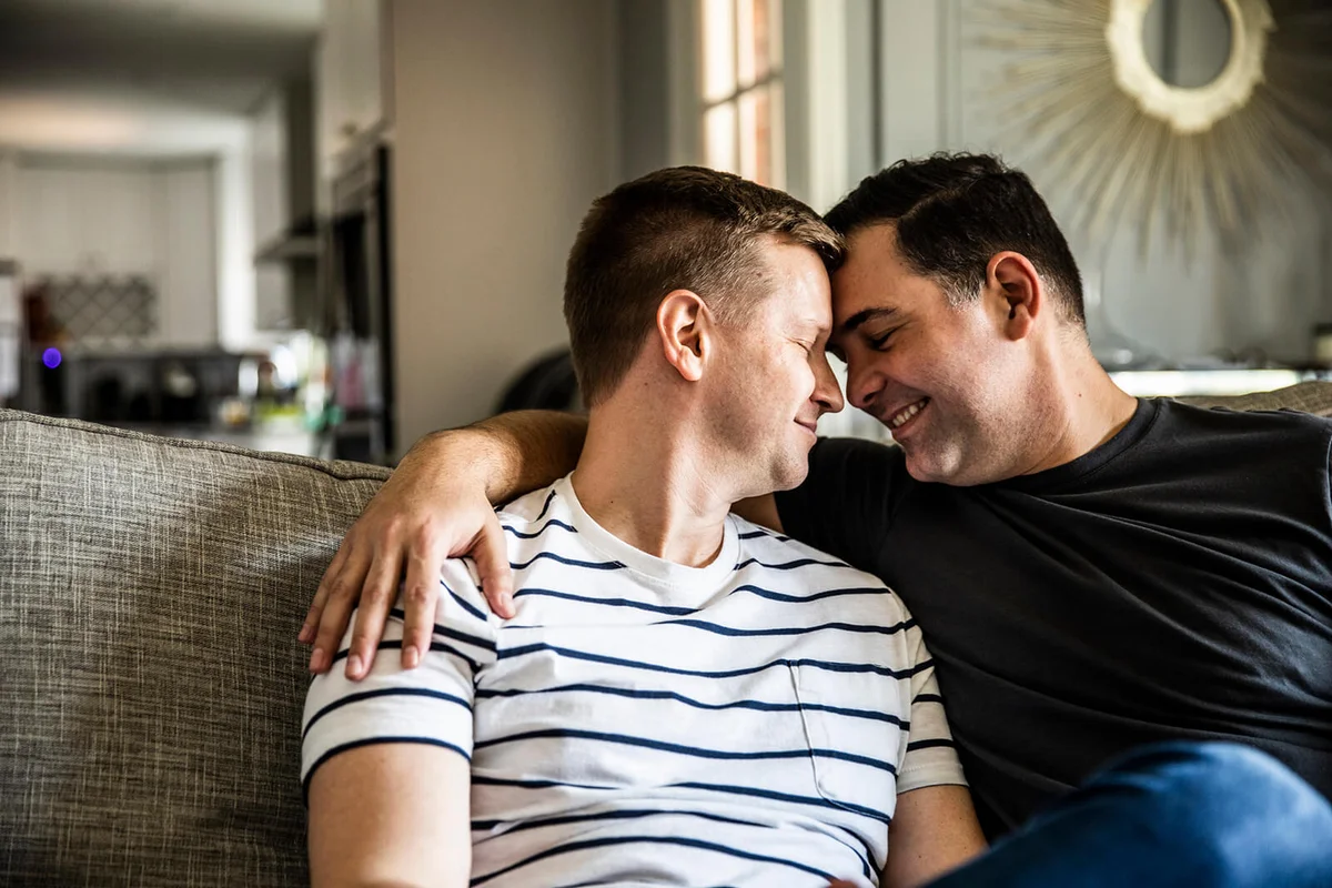 couple embracing on couch