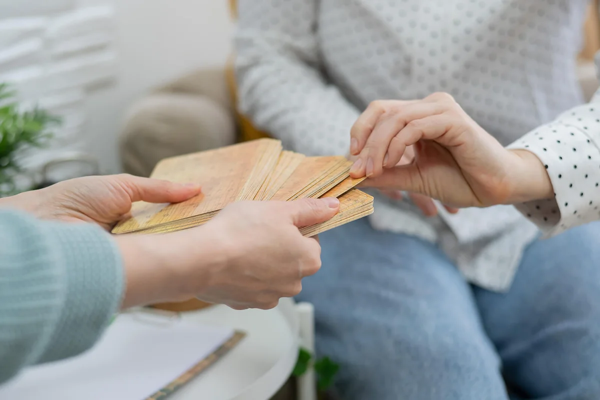 Midsection Of Man Holding Cards