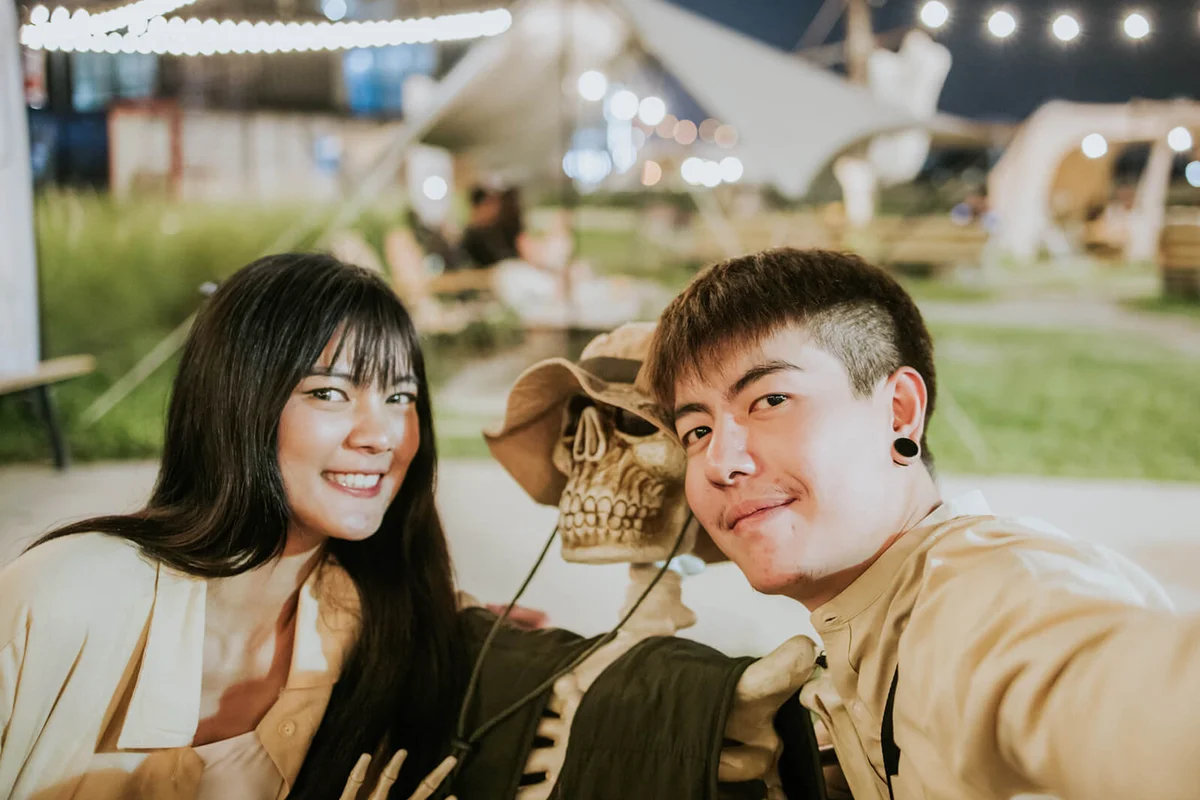 couple look at smart phone for lovely selfie during dating in Haloween