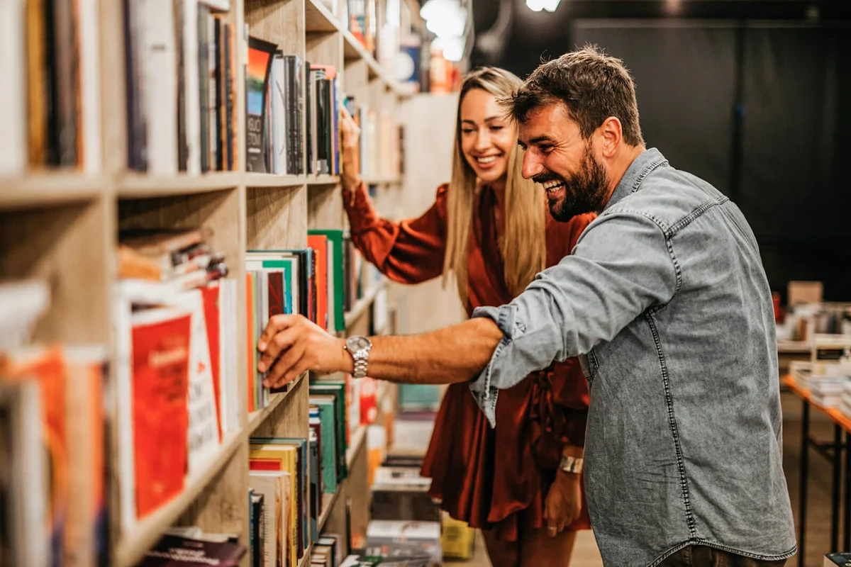 man and woman in the book store