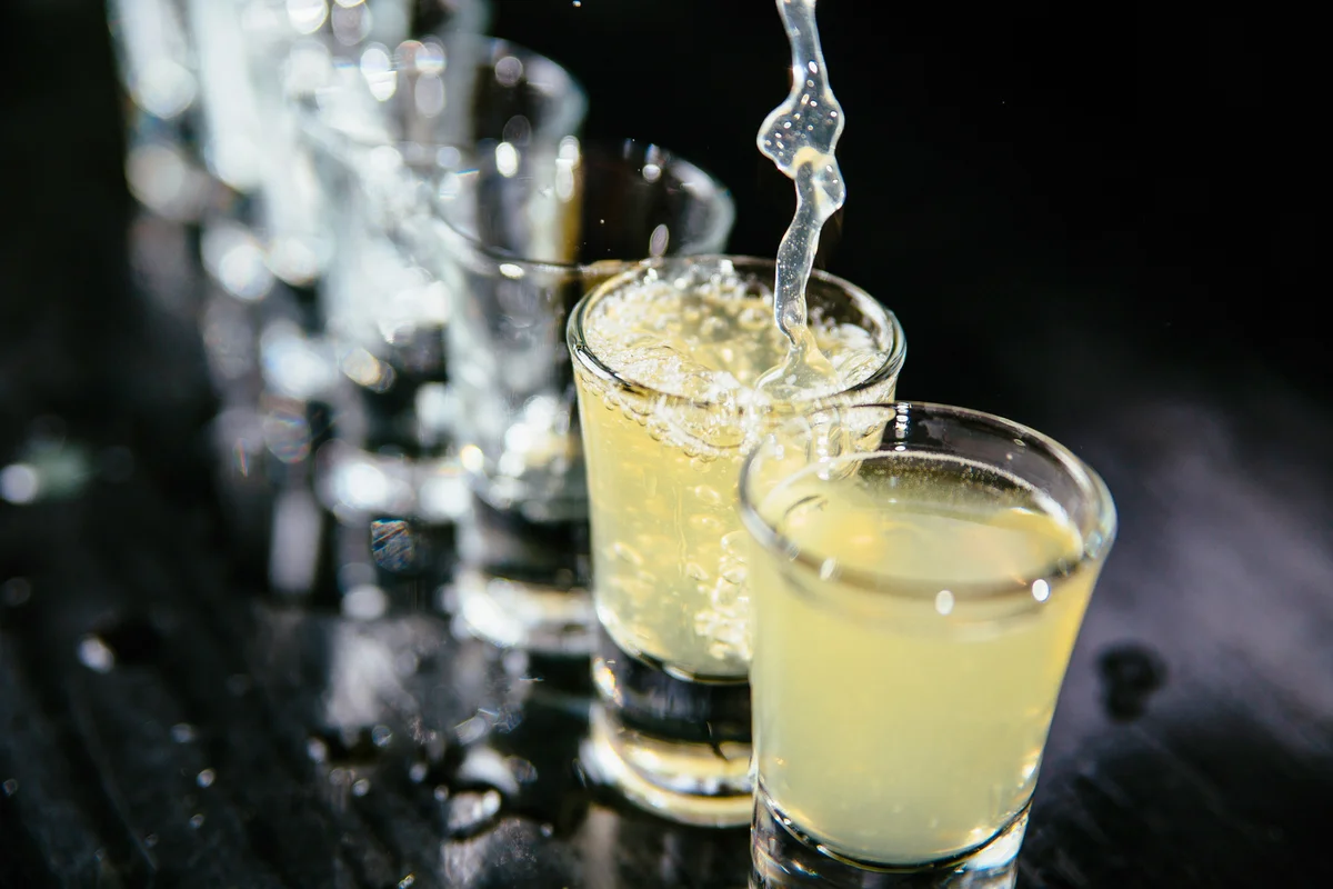 pouring shots in shot glasses