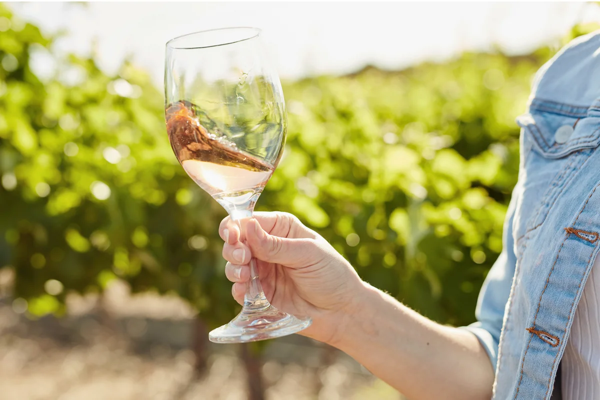 Woman swirling her glass filled with wine