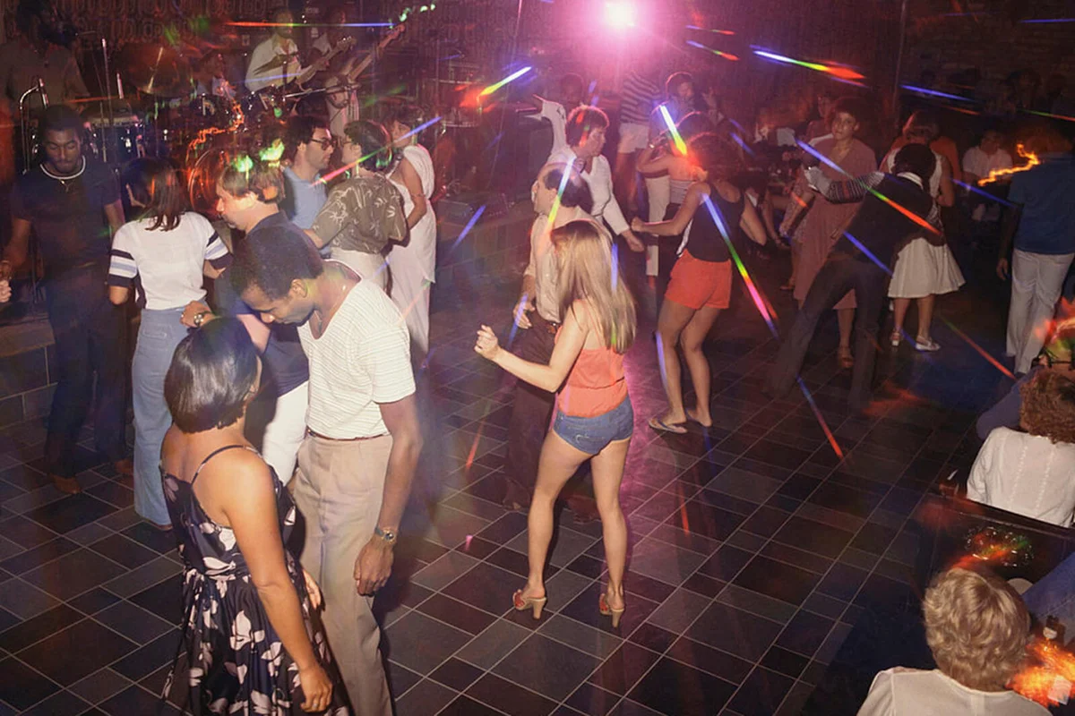 People dancing at disco nightclub