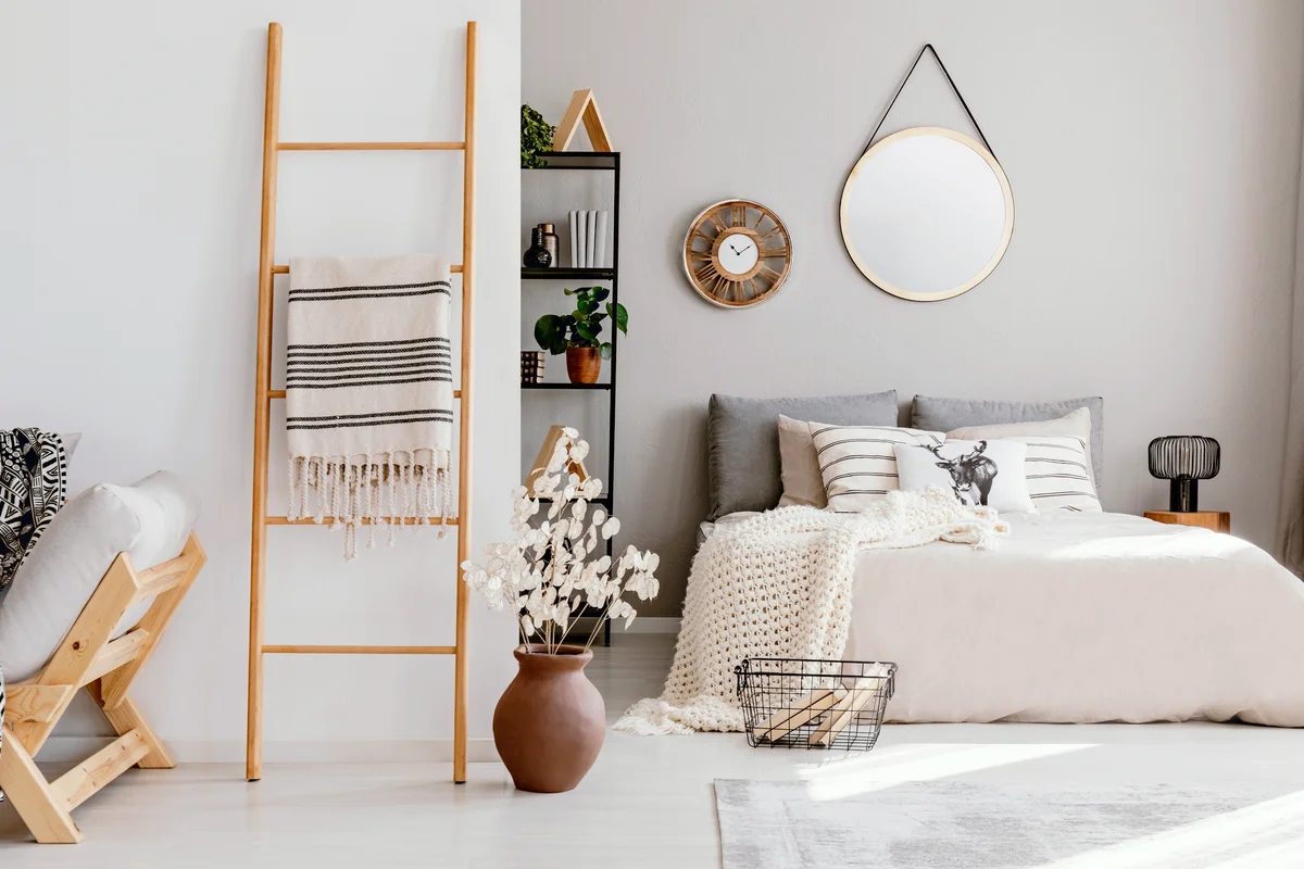 Bedroom interior with double bed with blanket ladder