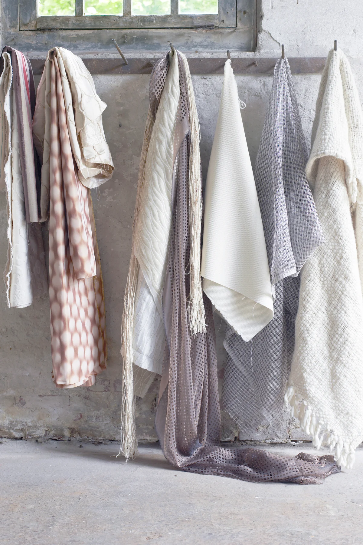 Blankets hanging in hooks