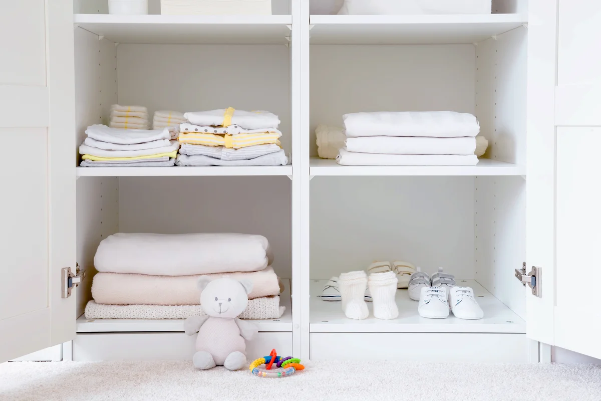 Blankets and baby items inside a cabinet