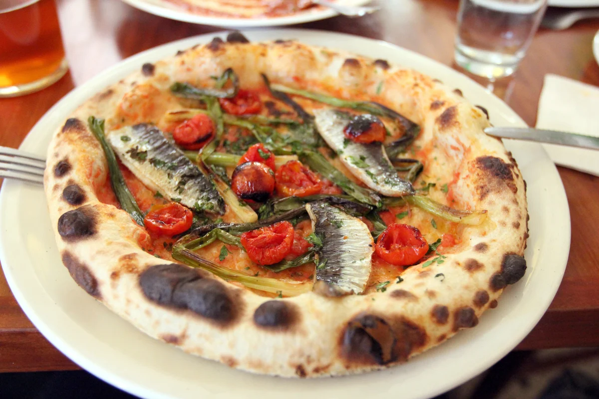 Pizza with fresh sardines