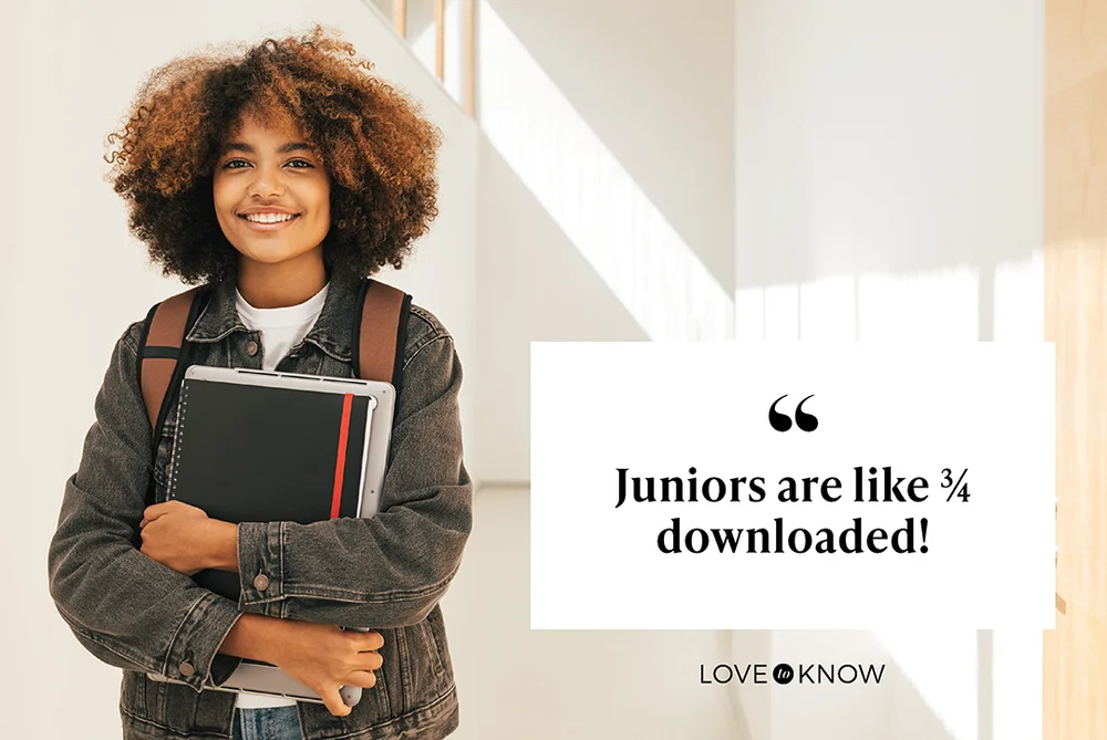 Smiling Student With Book In School