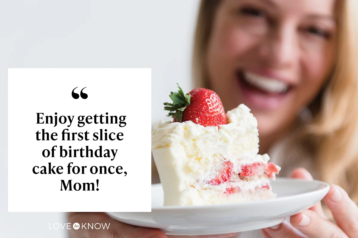 Woman holding slice on vanilla cake with strawberry