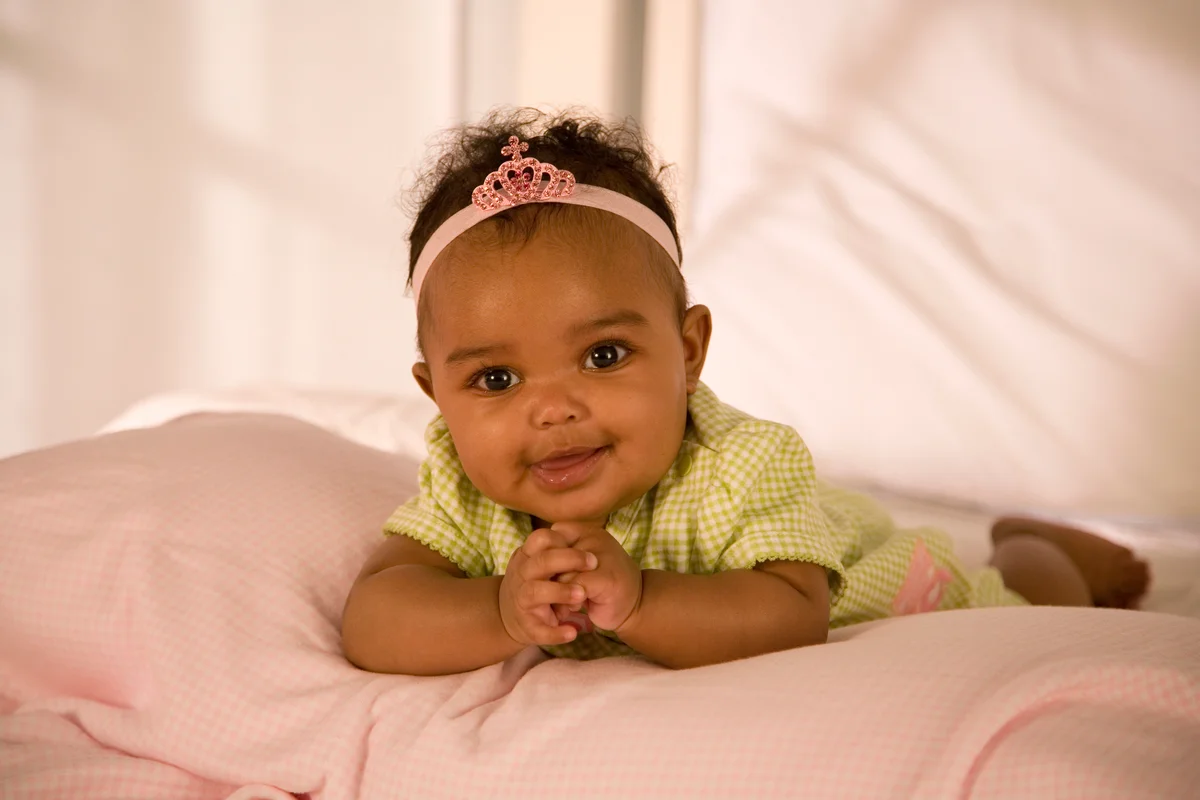 baby girl wearing a pink tiara