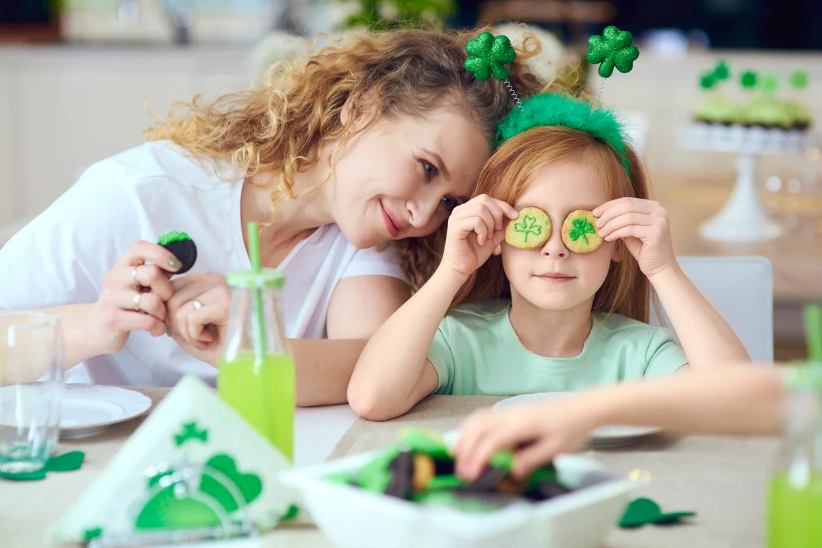 Mother with her child celebrating St. Patrick's day
