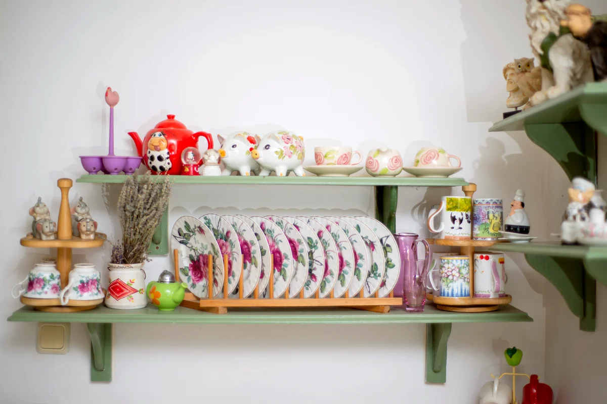 Kitchen counter with stacks of printed dishes, bowls and cups
