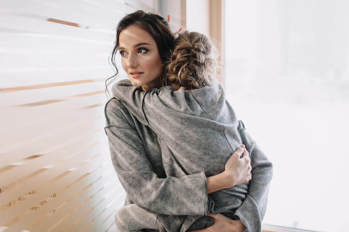Pretty young mother holding her lovely child