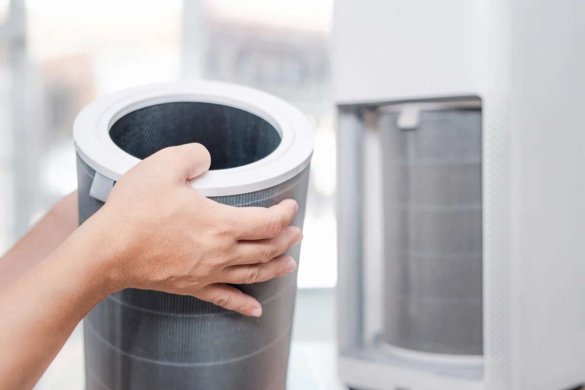 Man hold old dust filter of Air purifier