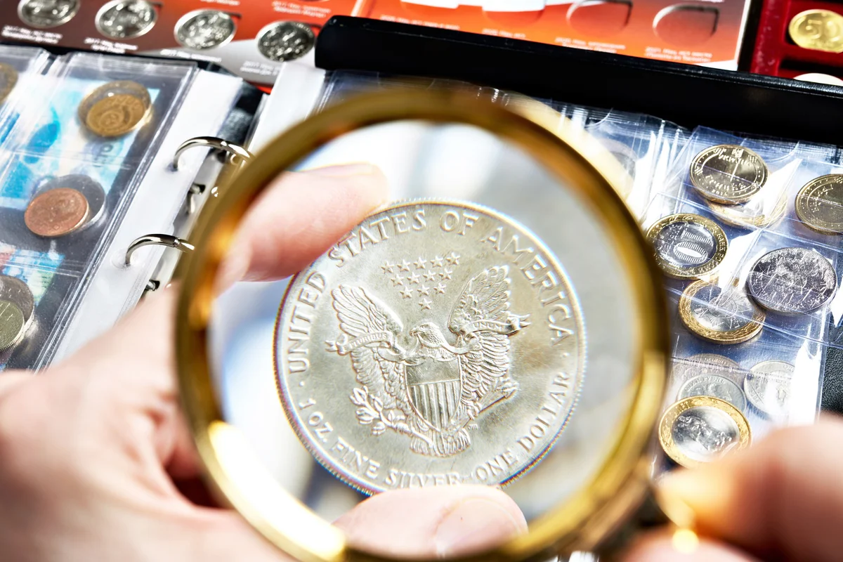 Numismatic silver dollar coin with magnifying glass