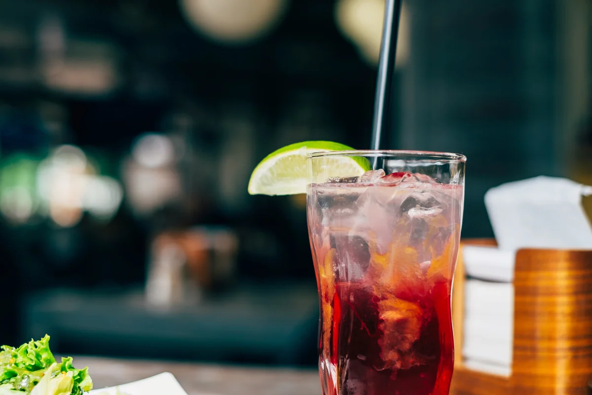 Alcoholic cocktail with cranberry and lime