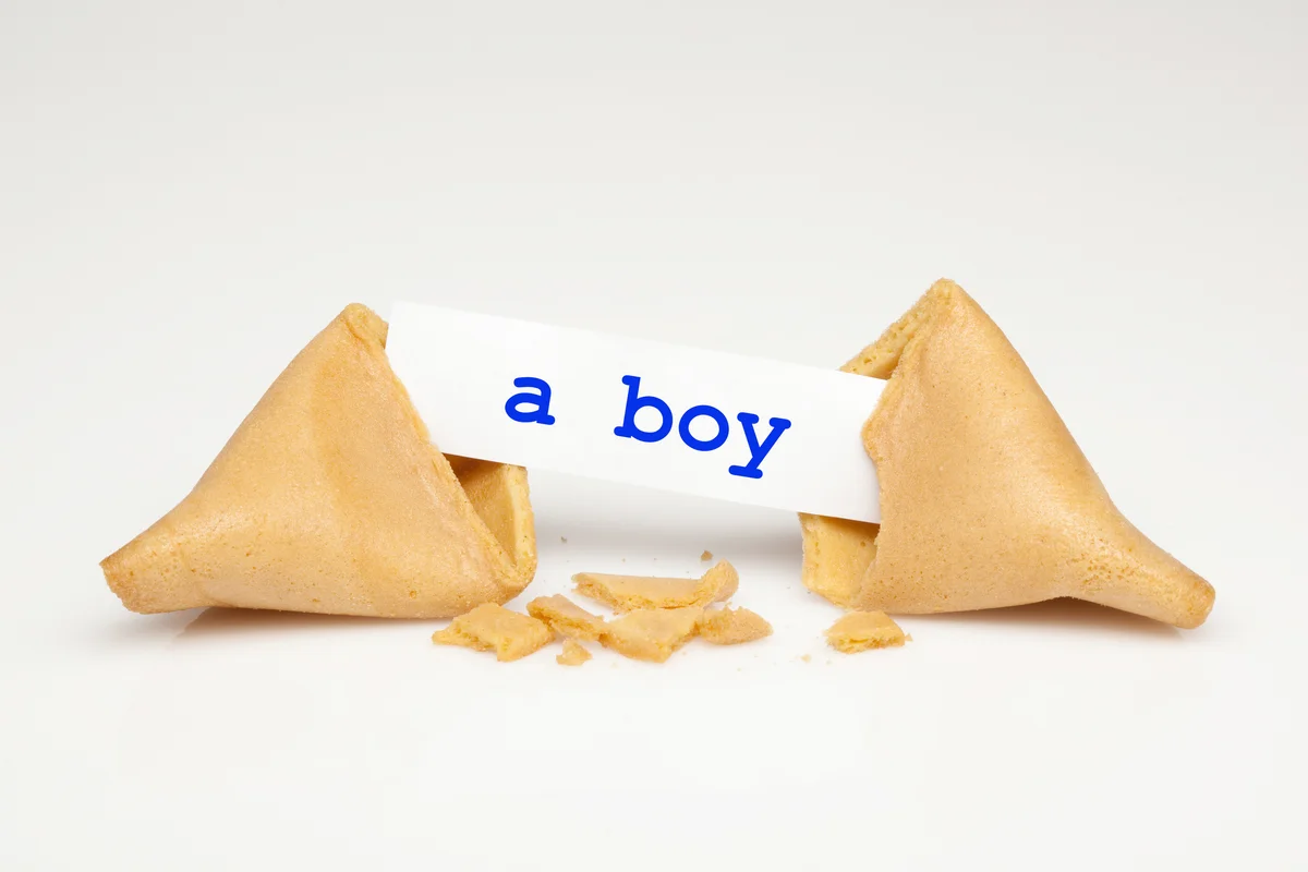 Broken fortune cookie with fortune stating it's a boy