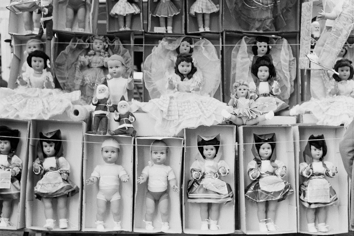 A display of dolls for sale at a market stall in Rome, circa 1960 - Getty Editorial