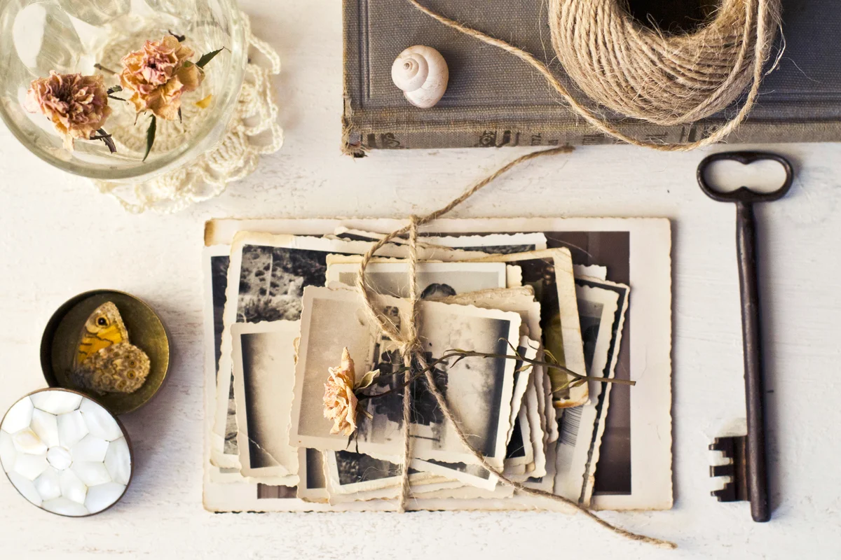 Vintage setting with old photographs and old key