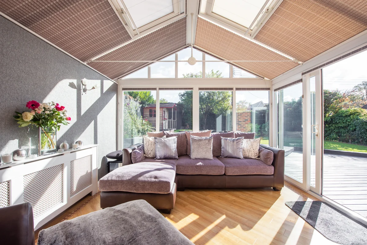 Interior view of a conservatory within a home with views into the back garden