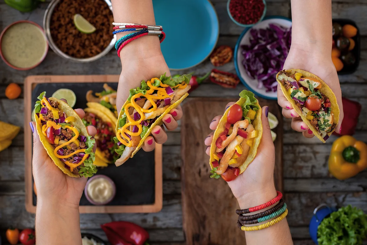 Variation of Mexican Tacos with spicy Salsa and nacho tortilla chips