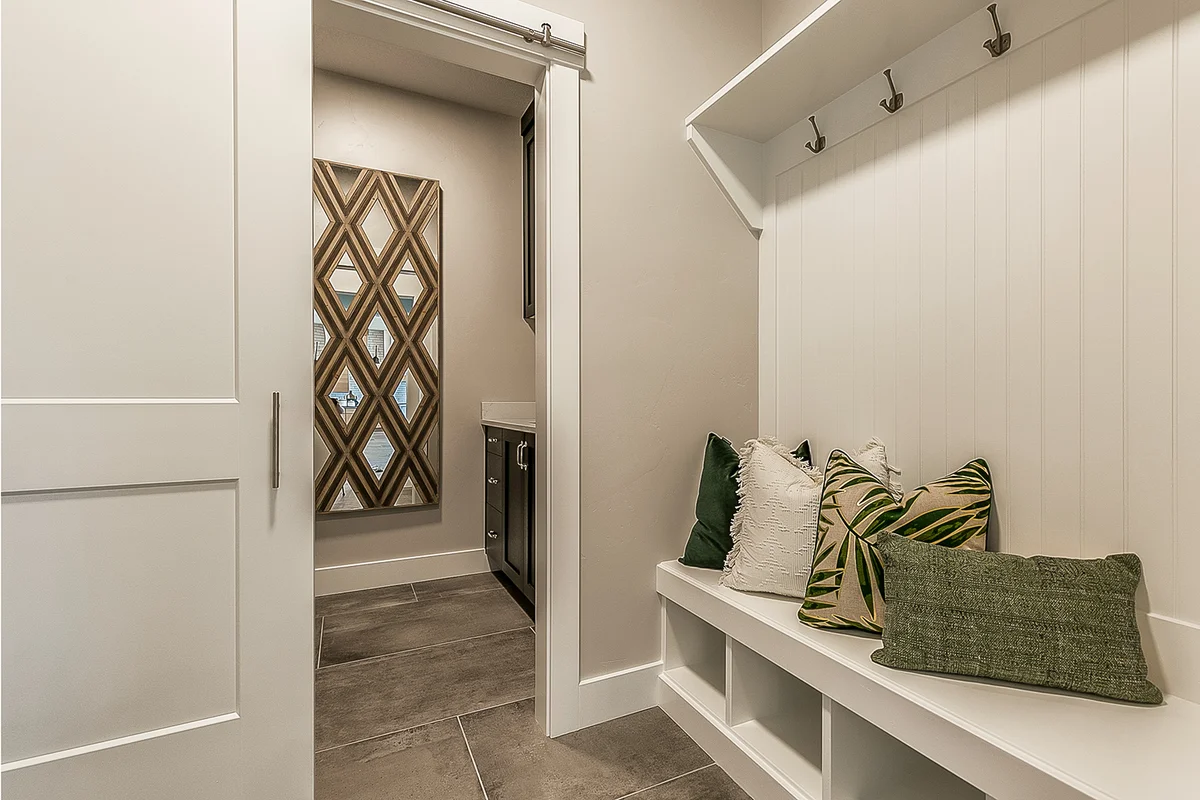 Shiplap wall in mudroom with mud bench