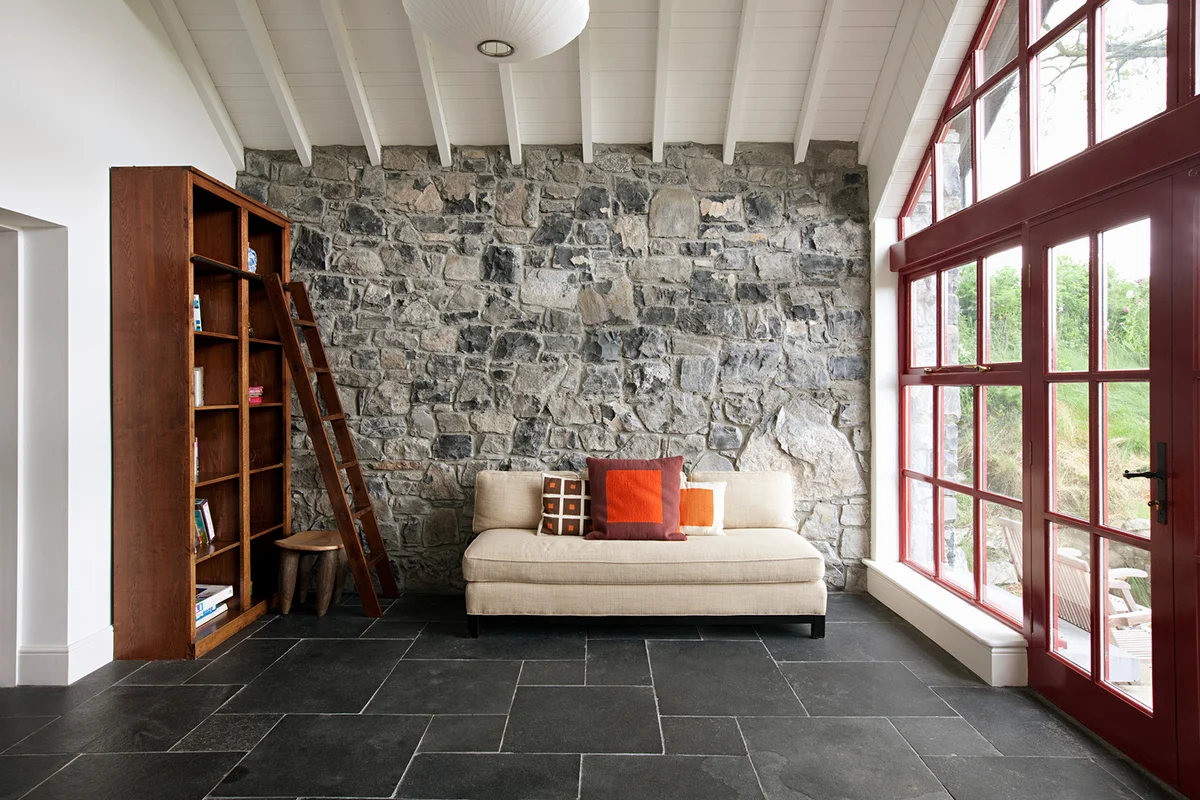 Minimal room with stone wall