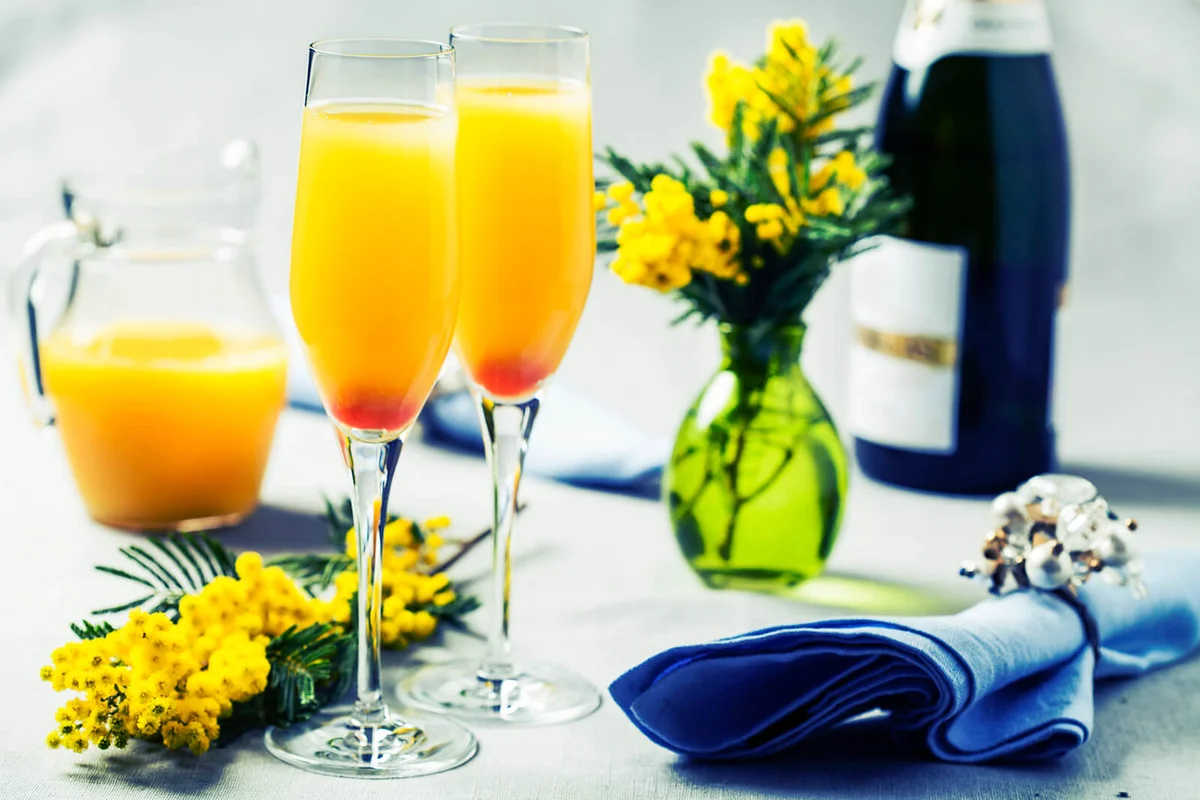 Two glasses with mimosa cocktail