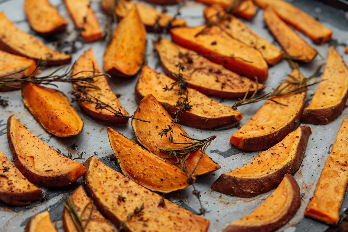Tray of oven baked sweet potato chips in closeup