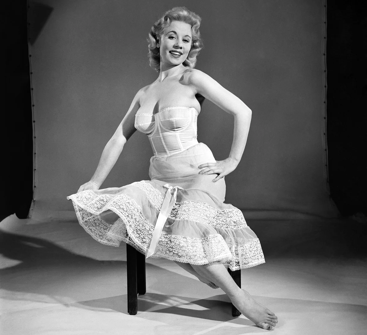 Woman wearing corsett and petticoat