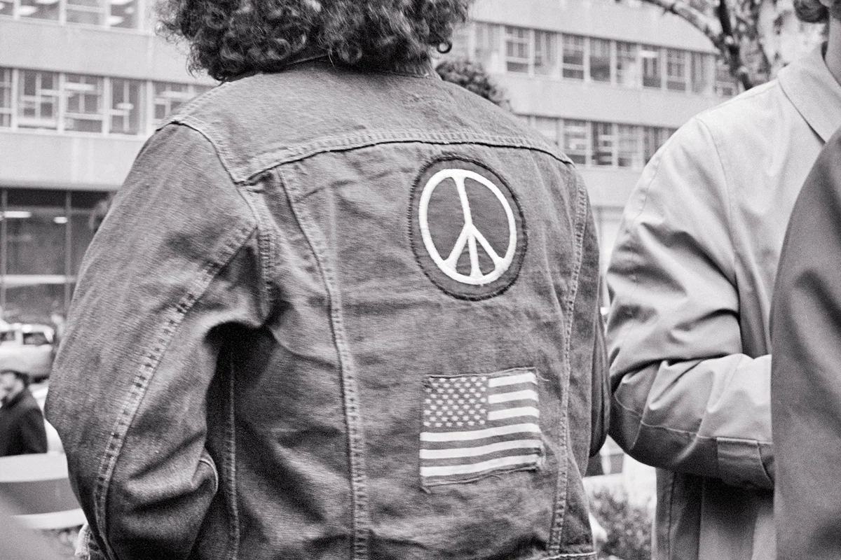 1960s 1970s Anonymous Male Hippie Back  Denim Jacket American Flag And Peace Symbol Patches