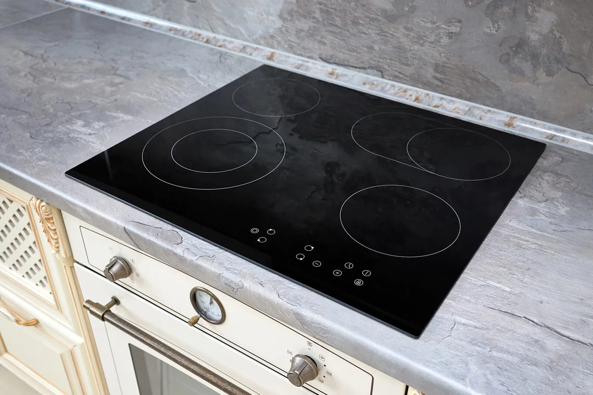 Modern kitchen interior with black induction stove cooker