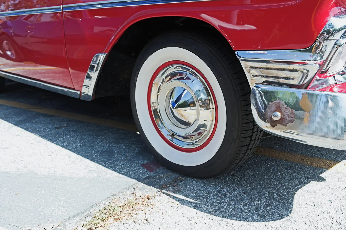Chrome Hubcap on White Wall Tires