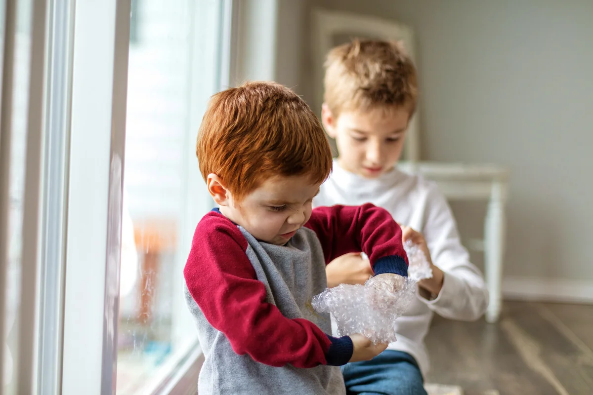 Kids playing with bubble wrap