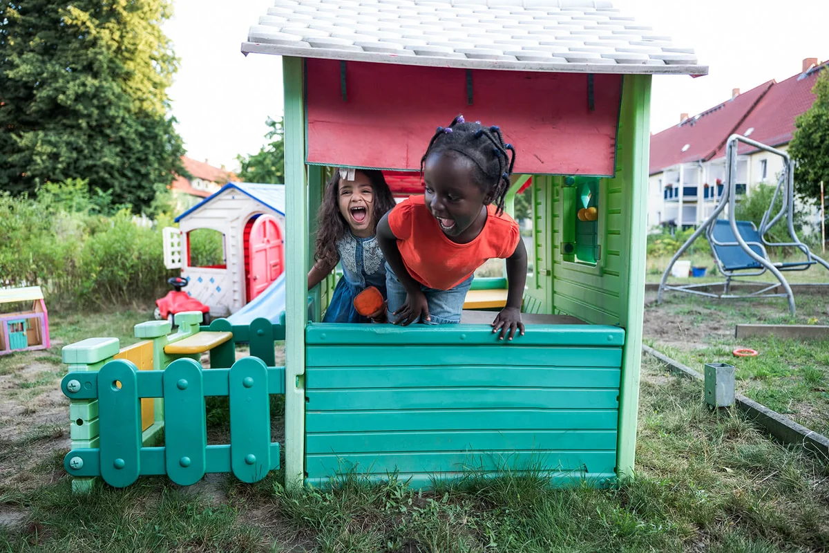 Children have fun in a playhouse